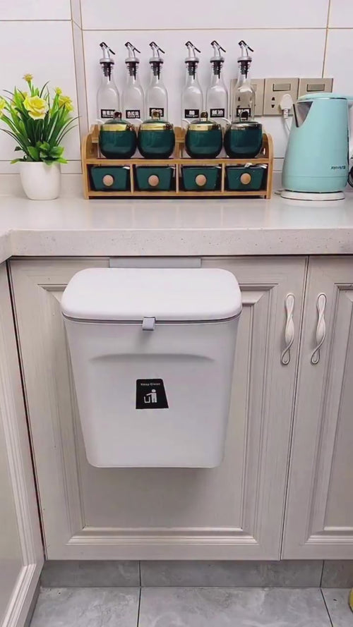 Video: hanging trash bin on a kitchen cabinet door in use