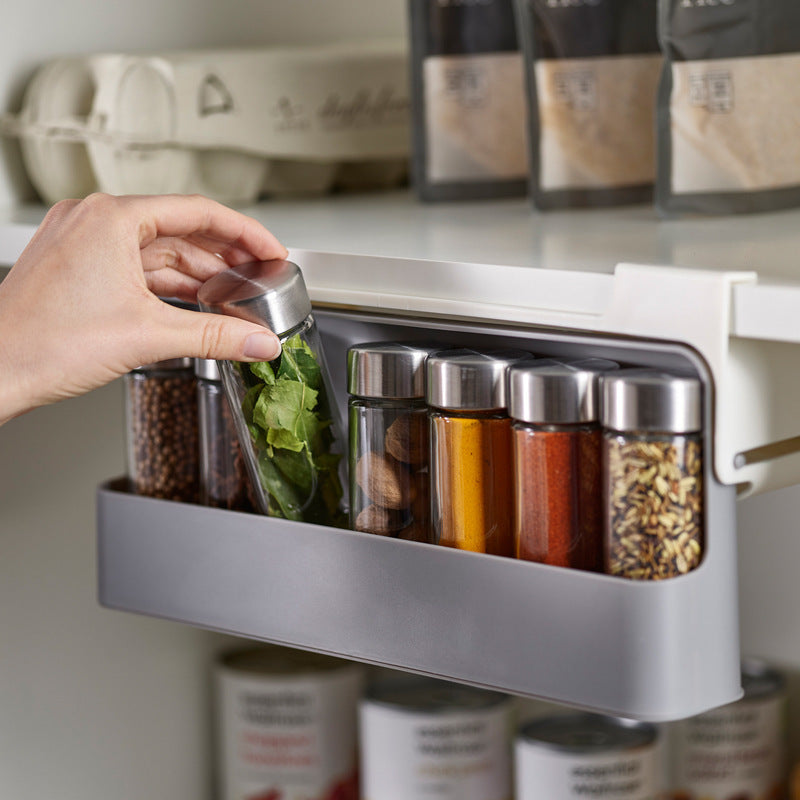Taking a spice jar out of the under-shelf rack