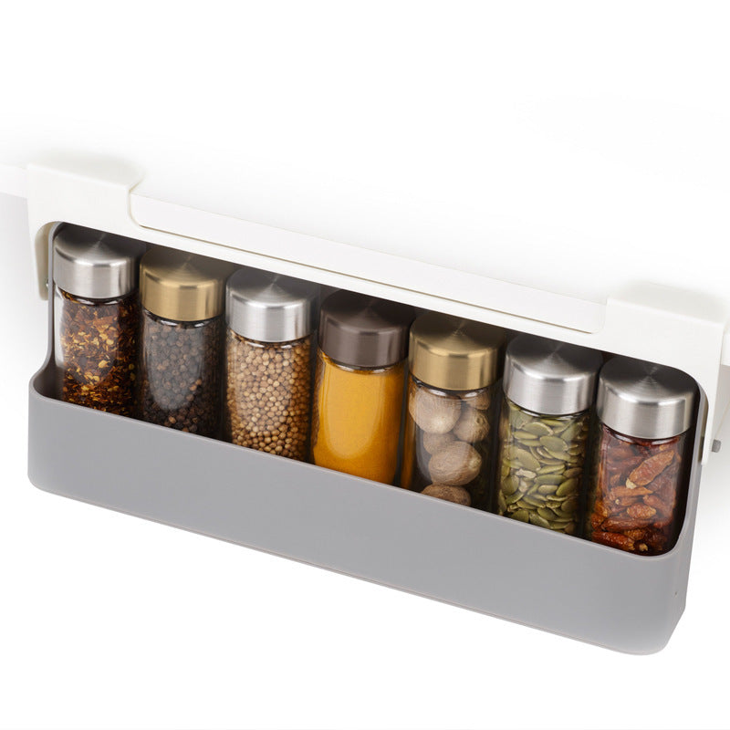 Spice rack pulled open showing 7 spice jars